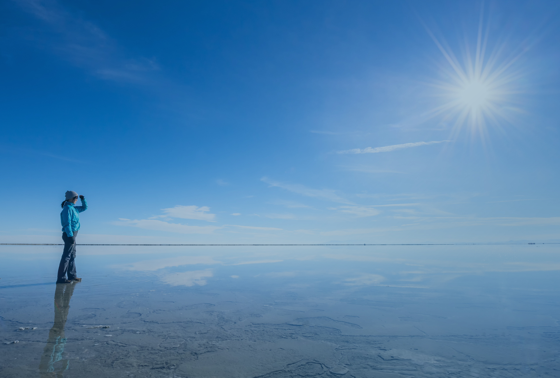 woman standing on frozen lake